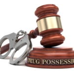 drug possession gavel handcuffs