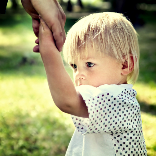 Sad Child hold the Parent Hand