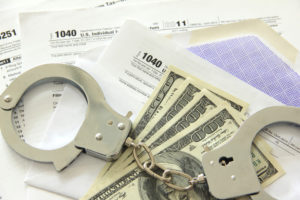 white collar crime money handcuffs