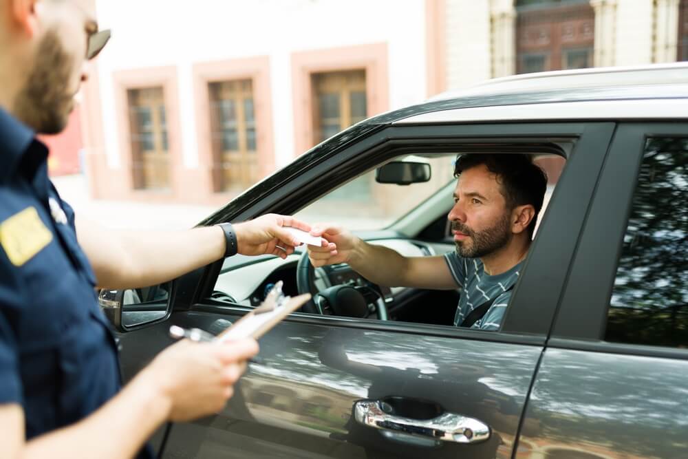 police officers giving a ticket